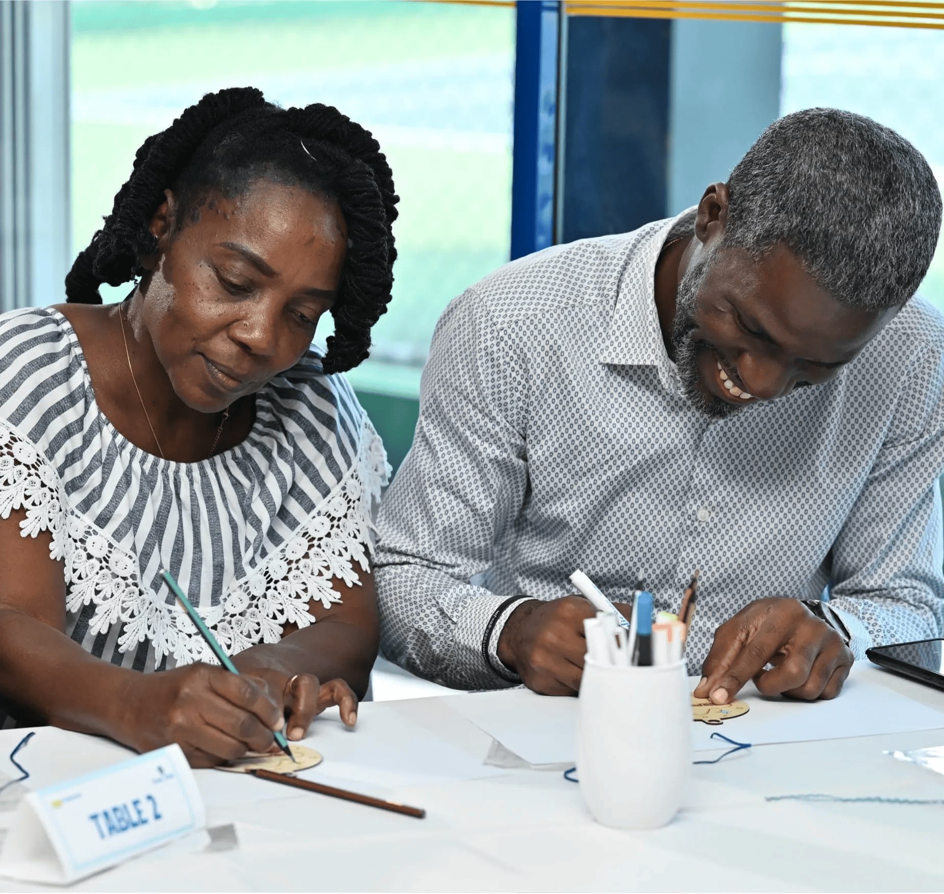 Man and woman participating in arts and craft task